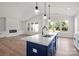 Open-concept kitchen and living area with modern design elements and ample natural light at 8632 Cedarbrook Dr, Charlotte, NC 28215