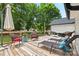 Spacious back deck featuring lounge chairs and umbrella, ideal for outdoor relaxation at 1004 Gracebrook Dr, Salisbury, NC 28147