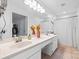 Bright bathroom featuring double sinks, white countertops and vanity, and a framed mirror at 1004 Gracebrook Dr, Salisbury, NC 28147