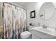 Clean bathroom features a shower-tub combo with a stylish shower curtain and white vanity at 1004 Gracebrook Dr, Salisbury, NC 28147