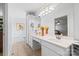 Bright bathroom featuring double sinks, white countertops, a framed mirror and a soaking tub at 1004 Gracebrook Dr, Salisbury, NC 28147