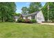 Exterior angle view of a home with vinyl siding, attached garage, and well-maintained lawn at 1004 Gracebrook Dr, Salisbury, NC 28147