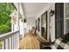 Cozy covered porch with rocking chairs, wood flooring, and decorative accents at 1004 Gracebrook Dr, Salisbury, NC 28147