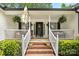 Inviting front porch with brick steps, decorative plants, and a welcoming entrance at 1004 Gracebrook Dr, Salisbury, NC 28147