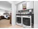 Convenient laundry room features modern appliances and built-in storage at 1004 Gracebrook Dr, Salisbury, NC 28147