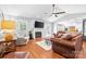 Bright living room features a fireplace, wood floors, and an open layout perfect for entertaining at 1004 Gracebrook Dr, Salisbury, NC 28147