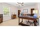Versatile home office with ample desk space, natural light, and cozy seating area at 1004 Gracebrook Dr, Salisbury, NC 28147