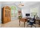 Bright office space with a large window, wooden desk, and built-in storage at 1004 Gracebrook Dr, Salisbury, NC 28147