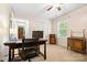 Functional home office with a spacious desk, natural light, and convenient storage options at 1004 Gracebrook Dr, Salisbury, NC 28147