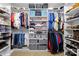 Organized walk-in closet with shelves and hanging rods providing ample storage for clothes, shoes, and accessories at 1004 Gracebrook Dr, Salisbury, NC 28147