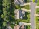 Aerial view of a property with a well-manicured lawn, driveway, and surrounding trees at 1008 Ladera Dr, Waxhaw, NC 28173