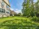 Large, well-maintained backyard featuring lush greenery and mature trees at 1008 Ladera Dr, Waxhaw, NC 28173