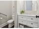 Half bathroom with white vanity, and ample storage space at 1008 Ladera Dr, Waxhaw, NC 28173