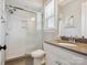 Modern bathroom featuring subway tile shower with glass enclosure, vanity with sink, and contemporary fixtures at 1008 Ladera Dr, Waxhaw, NC 28173