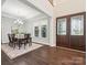 Dining room with hardwood floors, chandelier, and detailed trim at 1008 Ladera Dr, Waxhaw, NC 28173