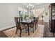 Bright dining room with hardwood floors and views of backyard at 1008 Ladera Dr, Waxhaw, NC 28173