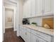 Stylish kitchen area with white cabinets, granite countertops, and a built-in coffee station at 1008 Ladera Dr, Waxhaw, NC 28173