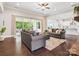 Open concept living room with hardwood floors and access to the patio at 1008 Ladera Dr, Waxhaw, NC 28173