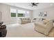 Spacious living room with carpet, large windows, recessed lighting, and neutral paint and furniture at 1008 Ladera Dr, Waxhaw, NC 28173