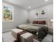 Bright bedroom with large window, luxury vinyl plank flooring, neutral walls and modern décor at 1016 Confederate S Ave, Rock Hill, SC 29732