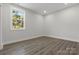 Cozy bedroom with vinyl flooring and large window offering ample natural light at 1016 Confederate S Ave, Rock Hill, SC 29732