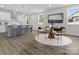 Open-concept kitchen and dining area featuring stainless steel appliances, kitchen island, and modern finishes at 1016 Confederate S Ave, Rock Hill, SC 29732