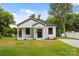 Charming single-story home featuring white siding, a covered porch, and a well-manicured lawn at 1016 Confederate S Ave, Rock Hill, SC 29732