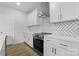 Kitchen features white herringbone tile backsplash, modern appliances, and sleek countertops at 1016 Confederate S Ave, Rock Hill, SC 29732