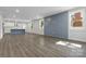 Spacious living room with hardwood floors leads to a modern open-concept kitchen at 1016 Confederate S Ave, Rock Hill, SC 29732