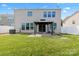 Spacious backyard with a gazebo, green lawn, and access from the home at 112 Artisan Ct, Mooresville, NC 28117