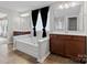 Elegant bathroom with dual vanities, a soaking tub, and modern fixtures at 112 Artisan Ct, Mooresville, NC 28117