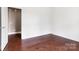 Bright bedroom featuring hardwood floors and ample natural light from a window at 112 Artisan Ct, Mooresville, NC 28117