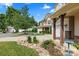 Scenic view of a home's exterior highlighting its landscaping, driveway, and inviting front porch at 112 Artisan Ct, Mooresville, NC 28117