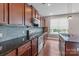 Updated kitchen with stainless steel appliances, granite countertops and tile backsplash at 112 Artisan Ct, Mooresville, NC 28117