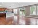Open concept living room with wood floors and stainless steel appliances at 112 Artisan Ct, Mooresville, NC 28117