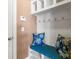 Mudroom with bench, coat rack and overhead shelving for added storage at 112 Artisan Ct, Mooresville, NC 28117