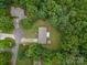 An aerial view reveals the home, wooded landscape, long driveway, and surrounding community at 1142 Foxberry Rd, Lincolnton, NC 28092