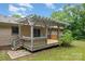 Back porch features a cozy wooden porch with a pergola on top, creating a perfect space for relaxing at 1142 Foxberry Rd, Lincolnton, NC 28092
