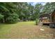 Spacious backyard with a swing set and plenty of green space for outdoor activities and entertainment at 1142 Foxberry Rd, Lincolnton, NC 28092