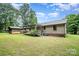 The beautiful backyard features a wood shed, well-maintained grass, and a cozy porch at 1142 Foxberry Rd, Lincolnton, NC 28092
