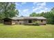 Spacious backyard featuring wood shed, deck, and lawn at 1142 Foxberry Rd, Lincolnton, NC 28092