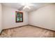 A cozy bedroom with a ceiling fan and window with wooden shutters at 1142 Foxberry Rd, Lincolnton, NC 28092