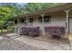 View of a welcoming front porch with gray railings and decorative plants adding to the curb appeal of the home at 1142 Foxberry Rd, Lincolnton, NC 28092