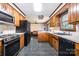 The kitchen is open to the living room and offers wooden cabinets and appliances at 1142 Foxberry Rd, Lincolnton, NC 28092
