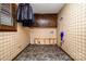 Laundry room with vinyl floor and checkered wallpaper at 1142 Foxberry Rd, Lincolnton, NC 28092