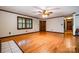 Hardwood floor in living room with a traditional brick fireplace and adjacent doorway at 1142 Foxberry Rd, Lincolnton, NC 28092