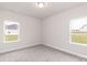 Well-lit bedroom with carpet, features two windows that offers natural light and exterior views at 115 Kerr Walk Dr # 37, Statesville, NC 28677