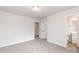 Bright bedroom featuring neutral walls, plush carpeting, and an ensuite bathroom for added convenience at 115 Kerr Walk Dr # 37, Statesville, NC 28677