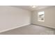 Bright bedroom features neutral walls, carpet flooring, and a window offering natural light at 115 Kerr Walk Dr # 37, Statesville, NC 28677