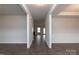 Bright entryway with hardwood floors and view into another room with fireplace at 115 Kerr Walk Dr # 37, Statesville, NC 28677